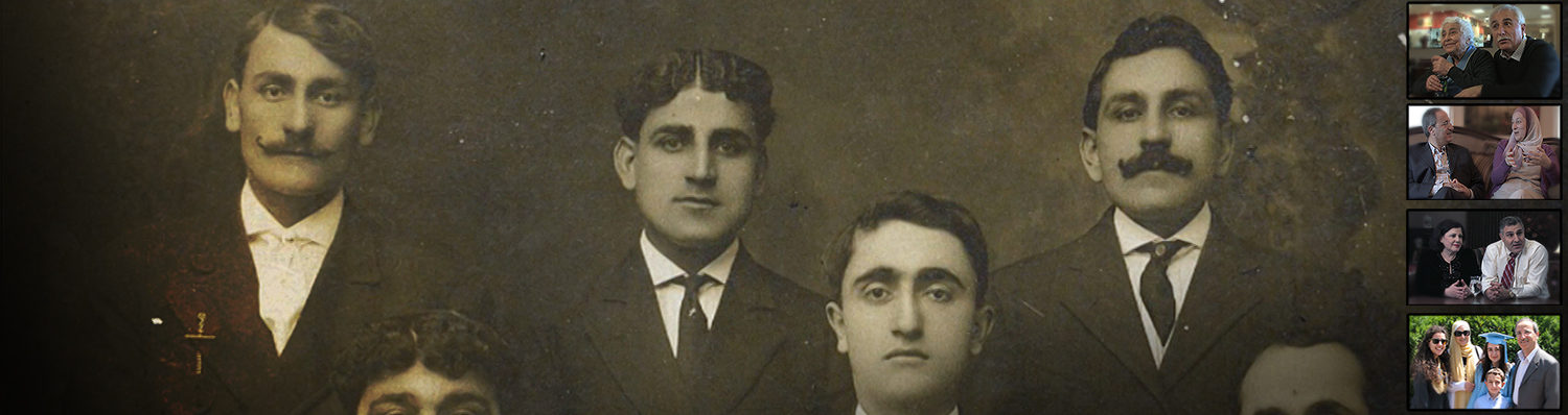 An old family portrait of four young white men, all wearing suits. They stand shoulder to shoulder, looking at the camera with neutral expressions.